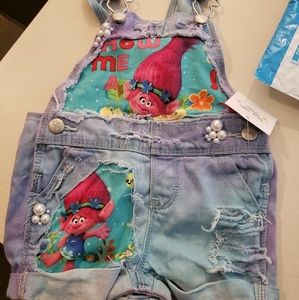 Toddler trolls overalls